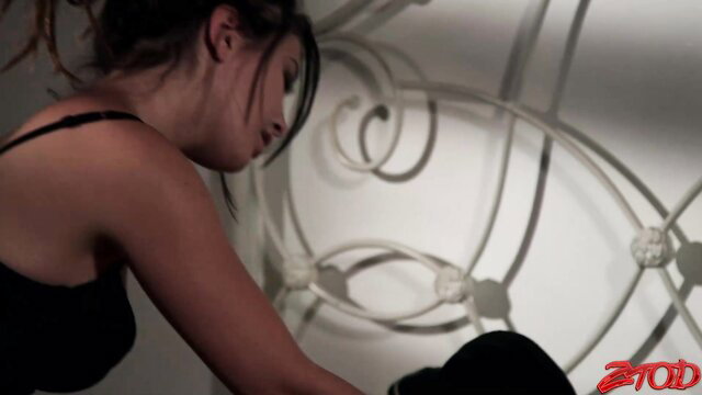 Daisy in Zero Tolerance seduces in black lingerie, teasing closeup