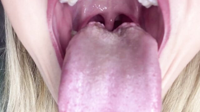Closeup of blonde babe's wide open mouth and long tongue in Giantess Birthday tease