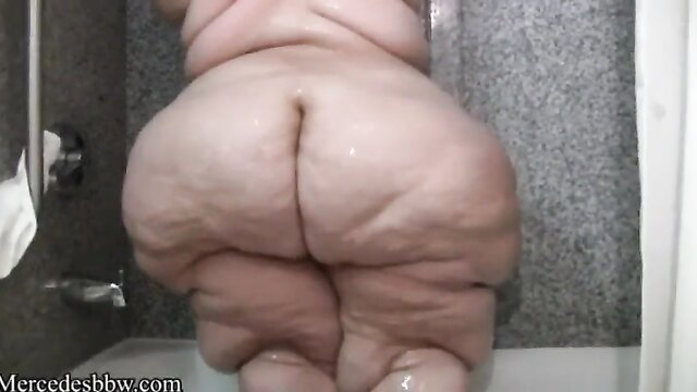 SSBBW pear-shaped model with massive ass washing up in shower