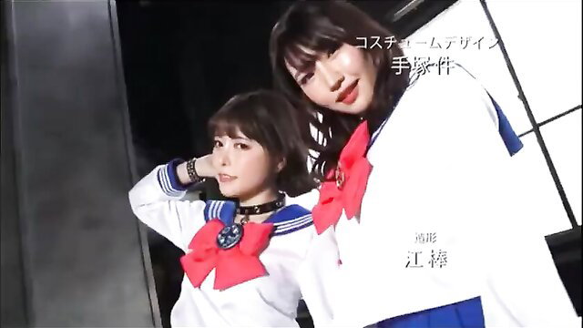 Two Japanese JAV girls in sailor school uniforms posing cutely together