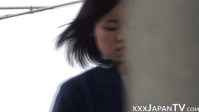 Cute Japanese girl in tracksuit, windy public outdoor tease