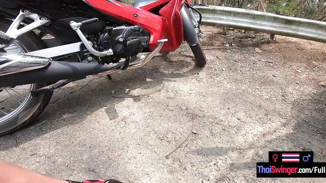 Red sportbike on roadside, Thai Swinger watermark, amateur Asian GF tease
