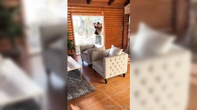 Busty blonde Angel Youngs peeking through window in tight jeans