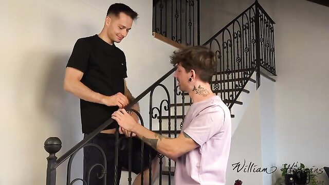 Two hot young roommates getting intimate on stairs in tight shirts and shorts