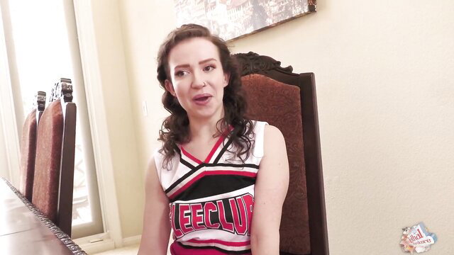 Charly Summer hot cheerleader in uniform smiling seductively