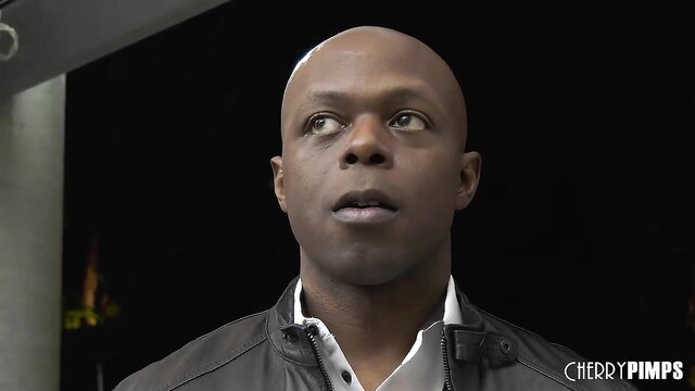 Bald Black stud Will Tile in leather jacket smirks at camera Cherry Pimps