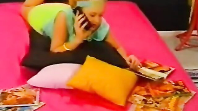 Teen blonde in green tank top on bed talking on phone with porn mags, Seventeen classic