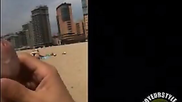 POV hand wanking to bikini girl on beach with highrises