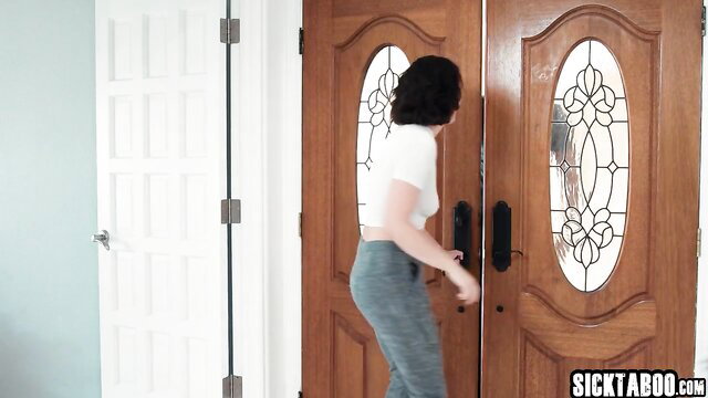 Casey Calvert in tight white crop top and grey leggings at door