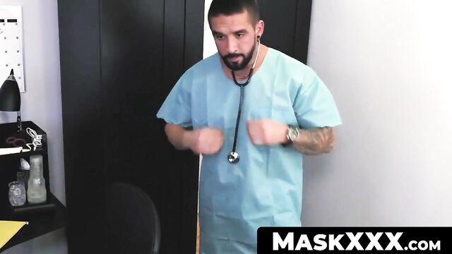 Tattooed muscular doctor in scrubs tests fleshlight with stethoscope