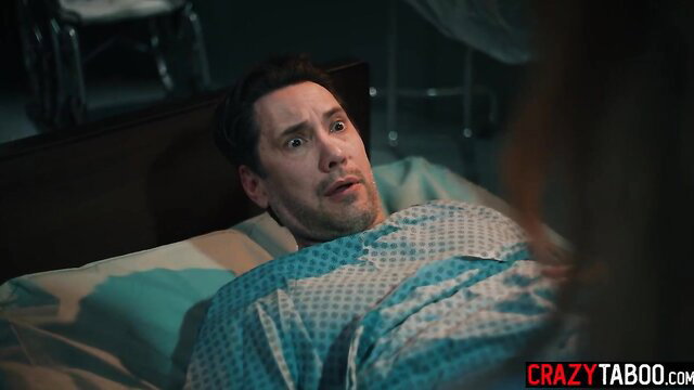 Tommy Pistol in hospital gown, wide-eyed shock during experiment