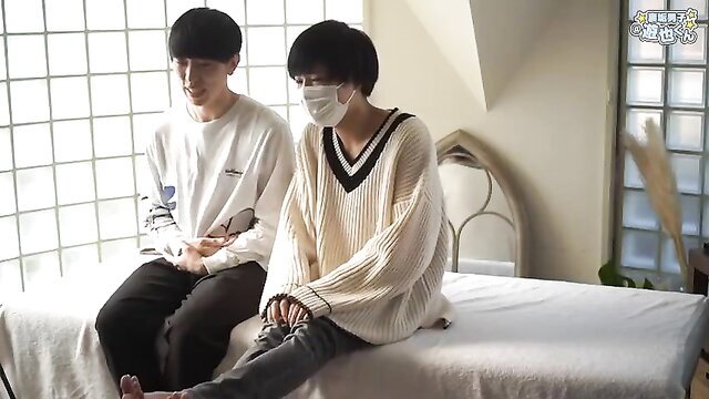 Two slim Japanese guys in cozy sweaters on bed, amateur gay tease