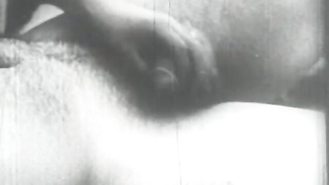 Vintage French stag film closeup of hand stroking erect penis