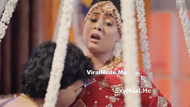 Desi Indian bride in red saree gets romantic suhagrat kiss from husband