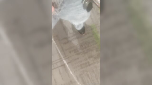 Blurry amateur woman in white dress squatting to piss on hallway floor