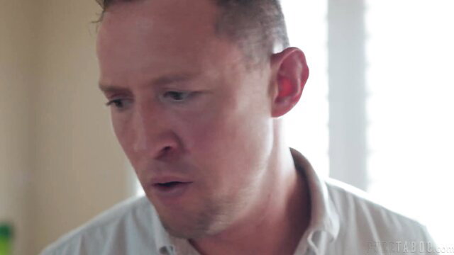 Closeup of shocked man in white shirt from Kenna and Pierce kitchen peaches video
