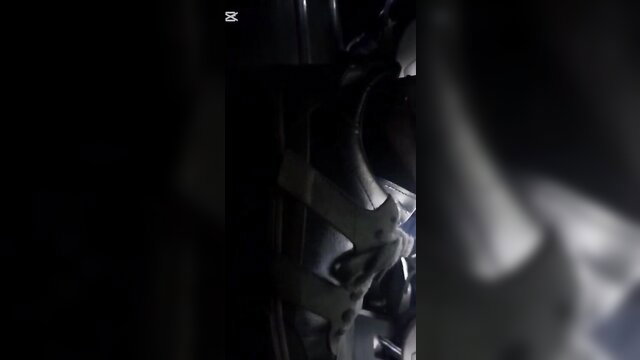 Candid closeup of white sneakers on sexy legs in bus