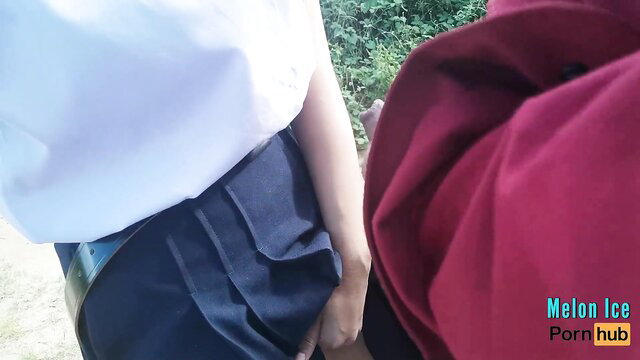 Melon Ice Thai teen in school uniform with teacher outdoors