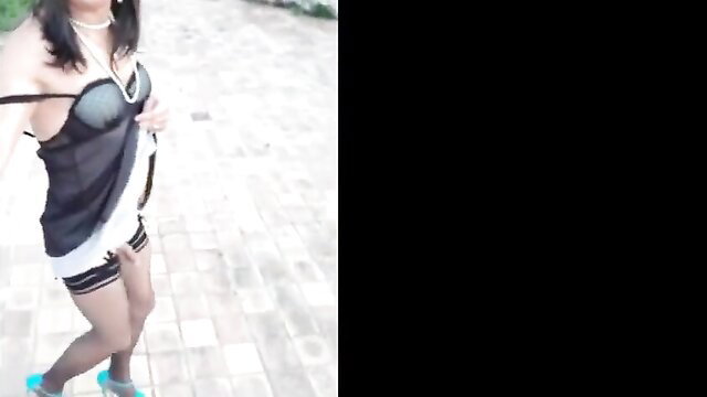 Asian Candice in sheer lingerie and stockings posing sexy outdoors