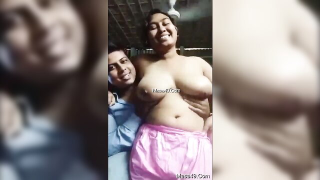 Desi Indian couple topless selfie, smiling busty woman with man hugging