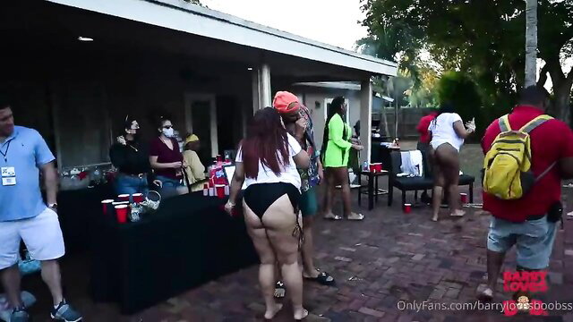 Thick ebony women in thongs at outdoor BBQ party, big asses exposed