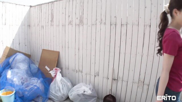 Rei in tight pink top, ponytail, glancing back seductively outdoors