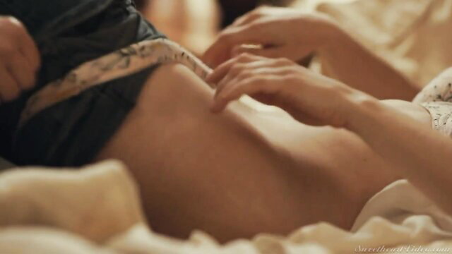 Hot babe fingers pussy under skirt in bed closeup