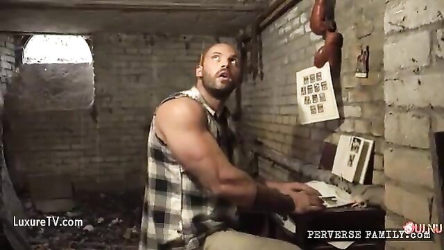 Muscular man in tank top bullies young girl in abduction scene