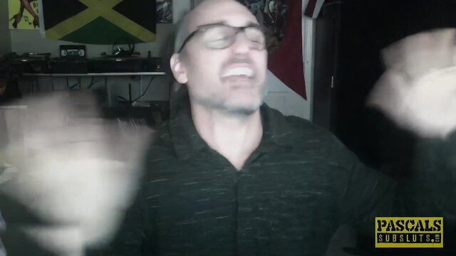 Bald man laughing in PASCALS adult video studio setup
