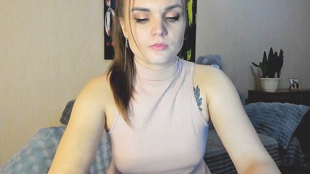 Amateur Chaturbate girl loveyou_elen in pink top, long brown hair, shoulder tattoo