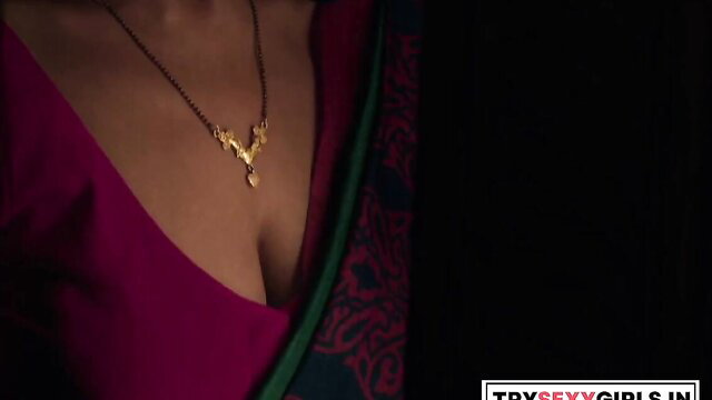 Indian bhabhi in deep pink saree blouse showing cleavage and gold mangalsutra