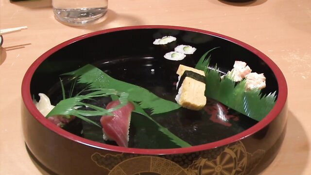Hot Japanese auntie sushi platter with tuna nigiri and tamago