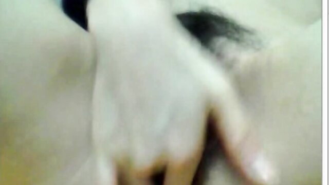 Blurry closeup of pale hand spreading wet pussy lips in amateur solo tease