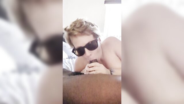 Blonde guy in shades sucking cock closeup, cumshot on face