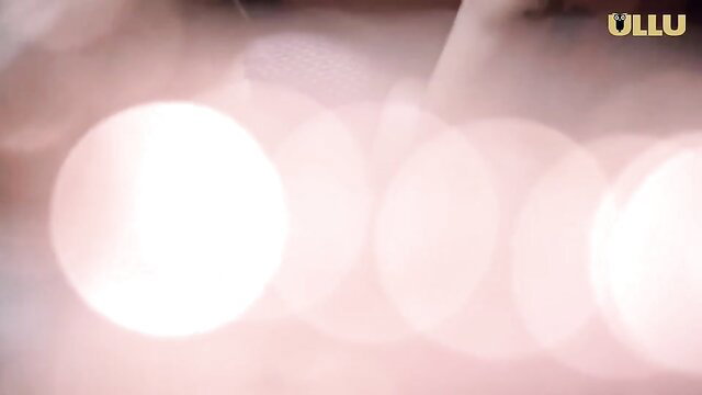 Blurred erotic Indian video thumbnail with pink bokeh lights