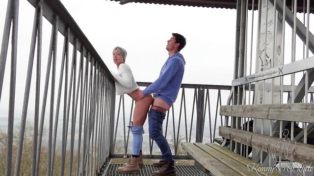 Konny bent over railing fucked by Blyde on public forest tower