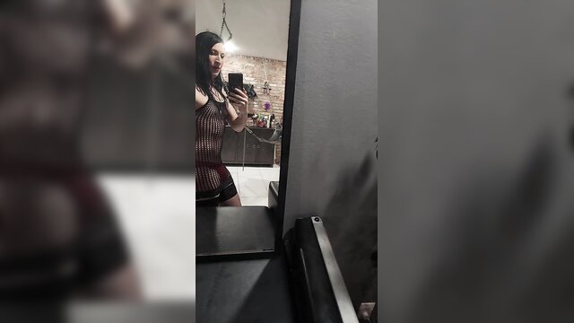 Gothic headmistress in fishnets shows huge ass and bulge mirror selfie