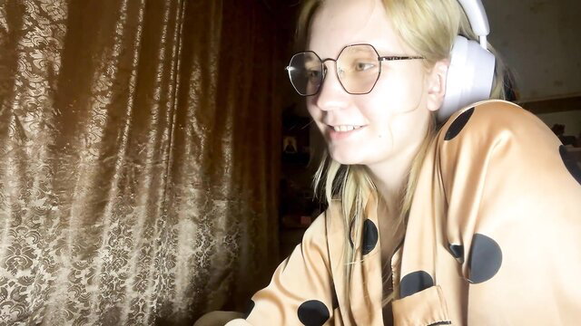 maybelleensminger shy 18yo teen in silk robe with headphones smiling