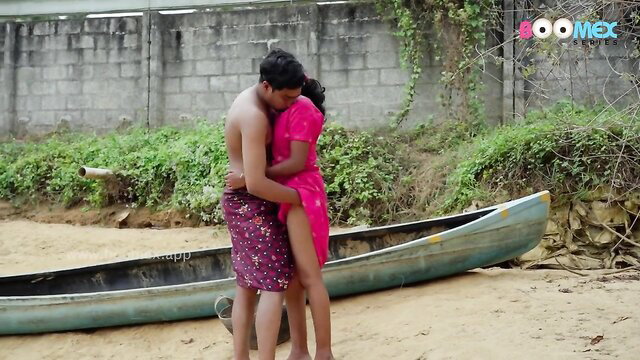 Indian couple in steamy outdoor embrace, passionate hug by river