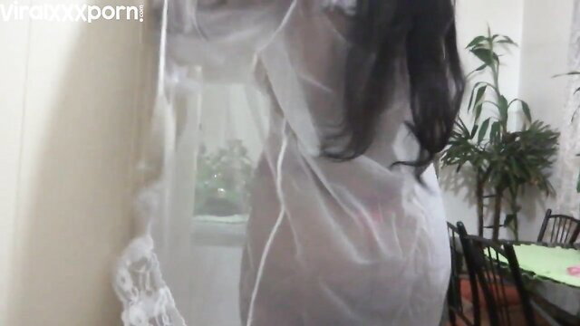 Horny Asian wife teases in sheer lingerie at home amateur video