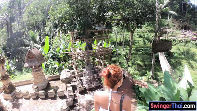 Redhead Thai girlfriend in Bali temple, outdoor tease