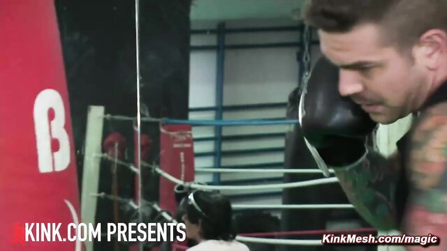 Tattooed man punches petite Asian girl in boxing gym gangbang