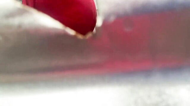 Closeup of red dildo penetrating wet pussy in outdoor public dressing room