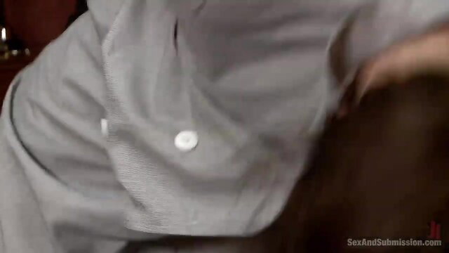 Brunette maid caught by horny stud, hand on her face in tense grip