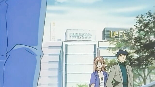 Asian JAV couple outside Rakko building, girl in jeans jacket, guy in turtleneck