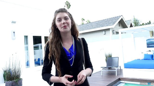 Leggy Russian teen Elena Koshka smiling in blazer by pool