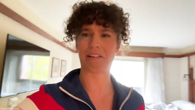 Curly-haired mature stepmom in tracksuit caught on vacation with stepson