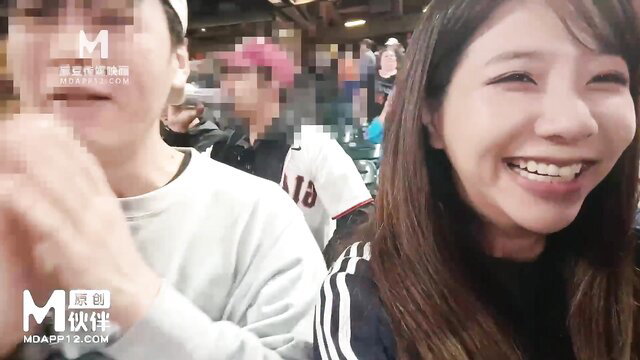 Wu Mengmeng smiling with blurred man at stadium, OnlyFans amateur tease