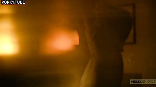 Blurry silhouetted figure in fiery glow, erotic high art tease