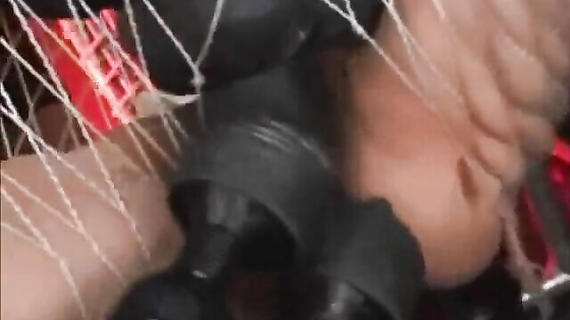 Asian babe bound in rope swing, huge tits squeezed by black dildos